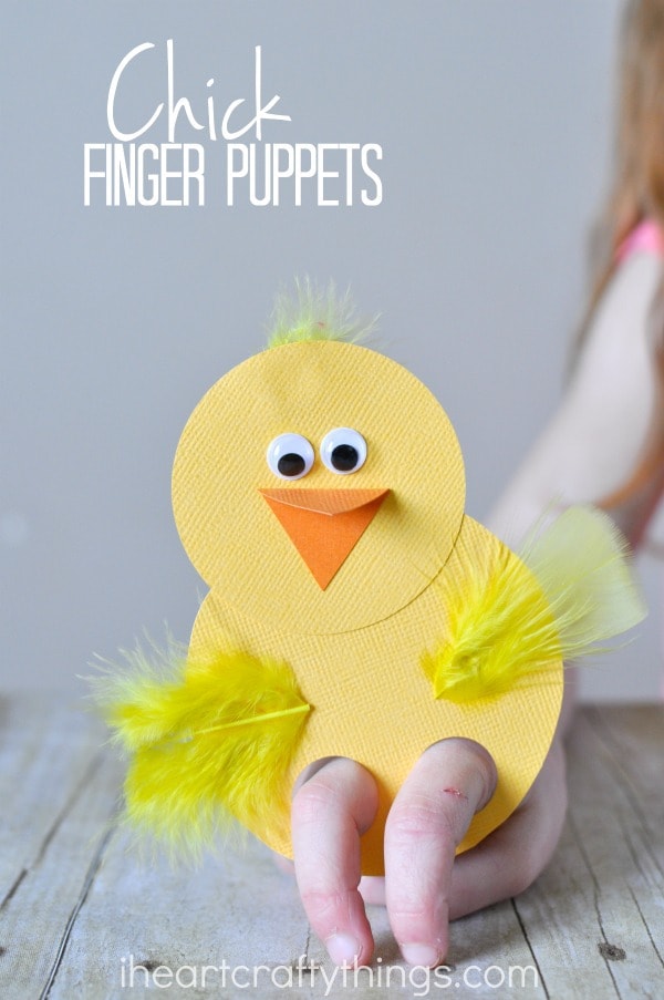 Vertical image of a child playing with a chick finger puppet with the words "chick finger puppets" in the top left corner.