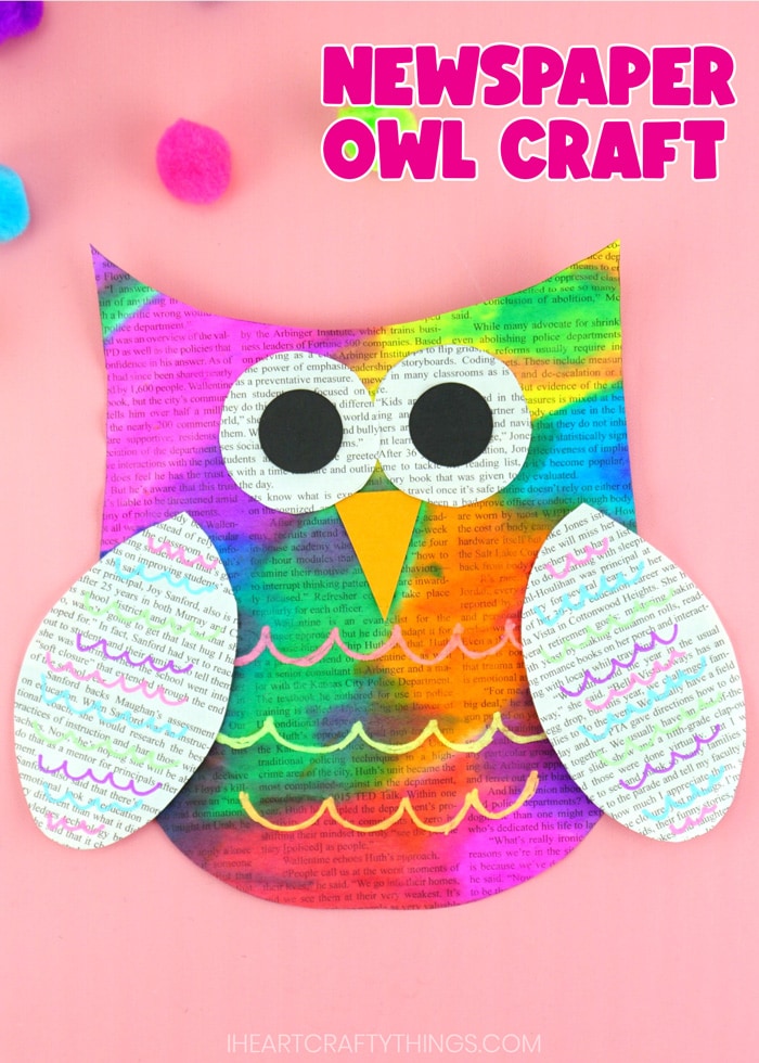 Vertical close up image of painted newspaper owl craft on a pink background with the words "Newspaper Owl Craft" in the top right corner.