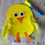 Close up image of finished paper chick craft with a yellow Fun Chalk marker laying in the top right corner.
