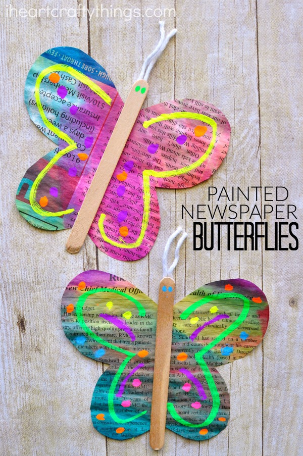 vertical image of two painted newspaper butterfly crafts with the words "painted newspaper butterflies".