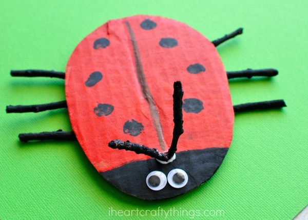 close up image of the y-shaped stick antennae of the cardboard ladybug craft