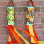 Easy fall windsock craft for preschoolers and toddlers. Fun fall craft for kids to explore the colors of the fall season.