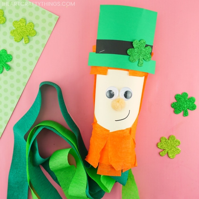 leprechaun windsock craft laying down on pink background