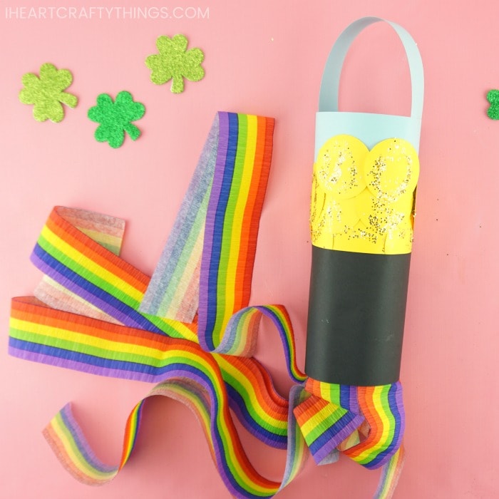 pot of gold windsock craft laying down on pink background
