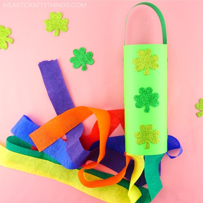 shamrock rainbow windsock laying on pink background