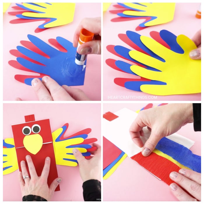 Four image collage showing adult gluing the handprints together to make parrot wings and then gluing them on the inside of the parrot puppet, then gluing crepe paper on the back of the puppet for tail feathers.