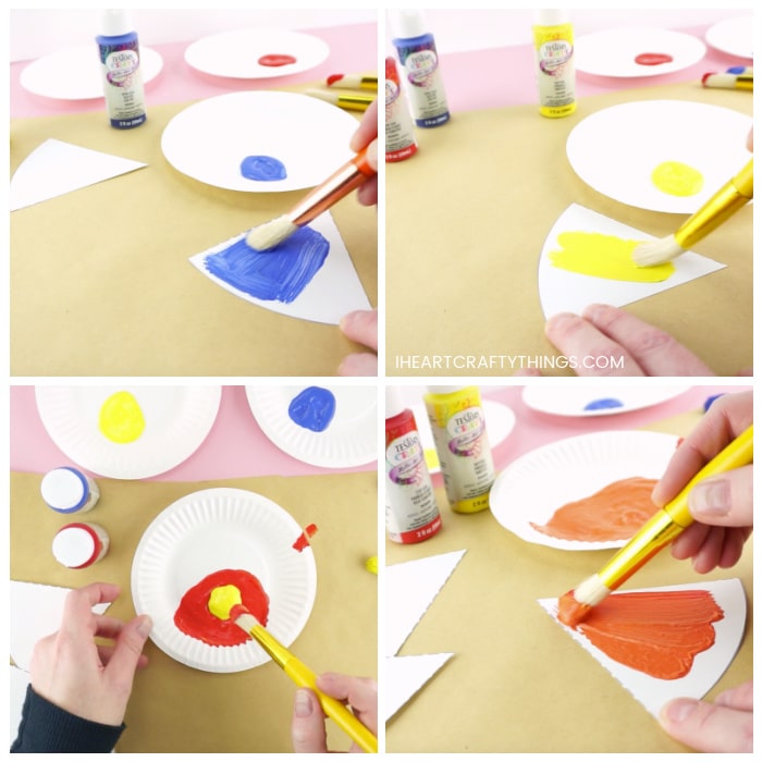Four image color showing someone painting one of the color wheel triangles with blue paint and yellow paint. Then mixing the red and orange paint together to make orange and painting a section of the color wheel with the orange paint.