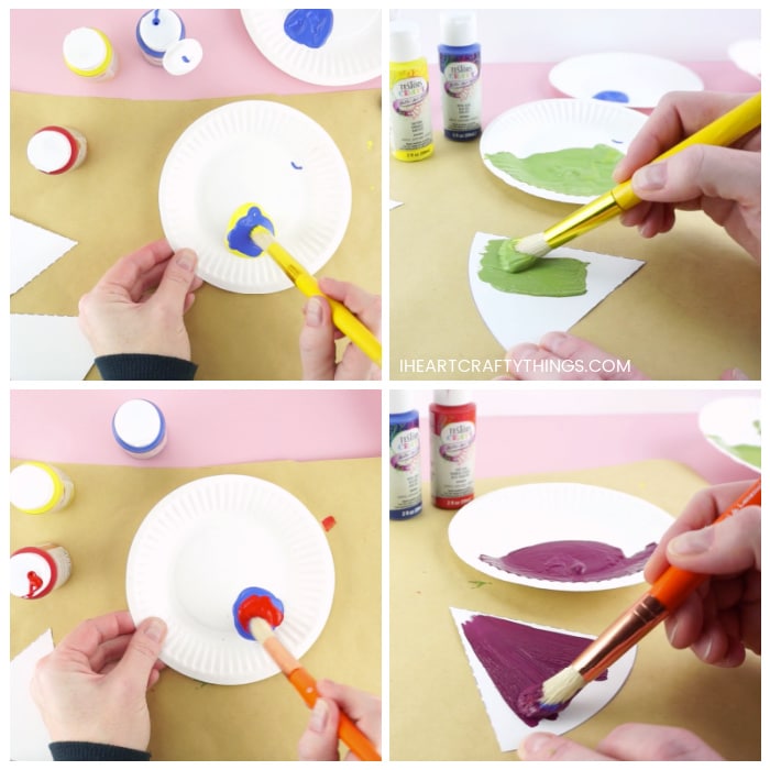Four image collage with top two photos showing someone mixing together blue and yellow paint to make green and painting a color wheel section with it. Then the bottom two photos showing someone mixing red and blue paint to make purple and painting a color wheel piece with it.