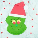 Use our free template to create this fun paper plate Grinch craft. Fun Christmas craft for kids and paper plate Christmas crafts for kids.