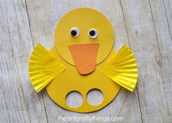 close up image of yellow duck finger puppet.