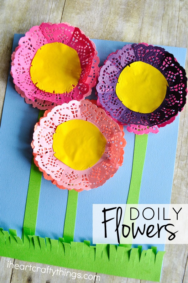 Vertical close up image of flowers craft with the words "Doily Flowers" in the bottom right corner.