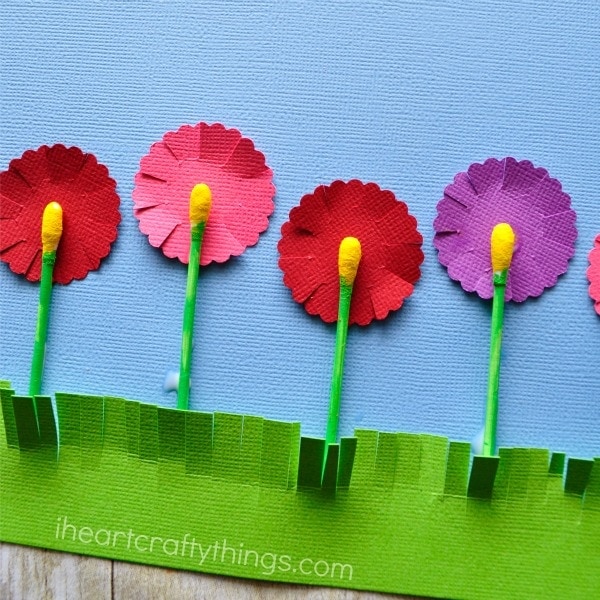 Close up image of flowers craft made from painted q-tips and paper.