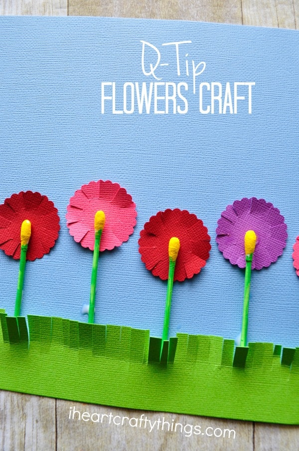 Vertical close up image of flowers craft with the words "Q-Tip Flower Craft" in the top right corner.