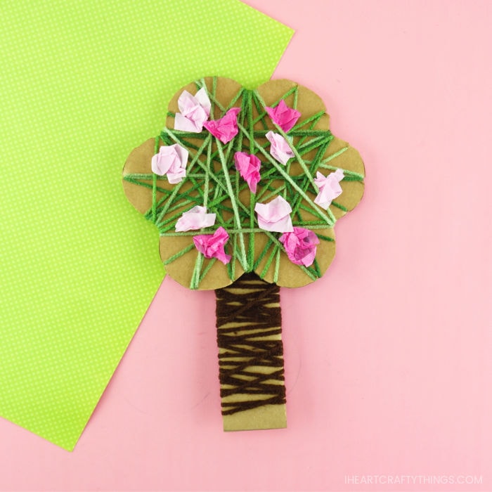 Square close up image of yarn wrapped spring tree craft.