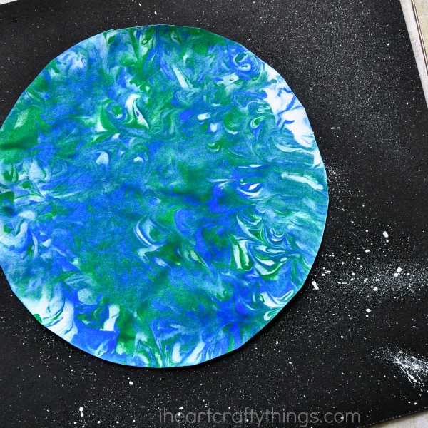 close up square image of marbled art earth day craft for kids