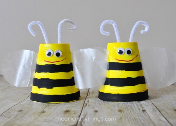 close up image of two foam cup bee crafts for kids to make