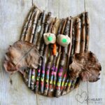 owl craft made from things found in nature: sticks, rocks, leaves.