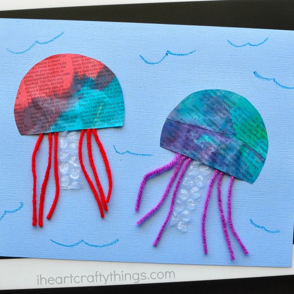 This colorful painted newspaper jellyfish craft is a perfect summer craft to make with the kids after visiting your local aquarium this summer.