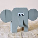 Here is a diy tutorial for how to turn a cereal box into an awesome cereal box elephant craft. Little ones might have trouble with cutting the cereal box but adults can do the cutting and kids will love painting, decorating and finishing their elephant craft. Fun animal craft for kids, recyclable kids craft and summer craft for kids.