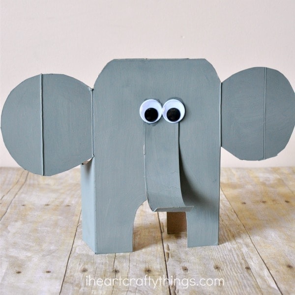 Here is a diy tutorial for how to turn a cereal box into an awesome cereal box elephant craft. Little ones might have trouble with cutting the cereal box but adults can do the cutting and kids will love painting, decorating and finishing their elephant craft. Fun animal craft for kids, recyclable kids craft and summer craft for kids.