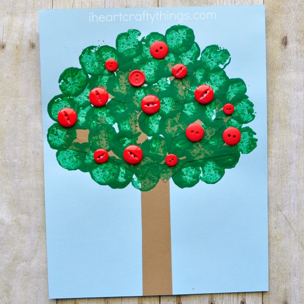 This wine cork stamped apple tree craft is not only a great excuse for opening up a bottle of wine this evening after the kids go to bed, but it also makes a fabulous fall kids craft. Fun apple craft for kids and preschool kids craft.