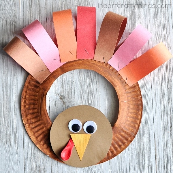 This paper plate Thanksgiving turkey craft is a great way for kids to help decorate for Thanksgiving. Fun Thanksgiving kids craft, preschool turkey craft, and fall kids craft.