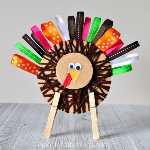 This yarn and ribbon Thanksgiving turkey craft is super cute and makes a perfect decoration for the holiday. Fun turkey craft for kids, Thanksgiving kids craft and fall kids craft.