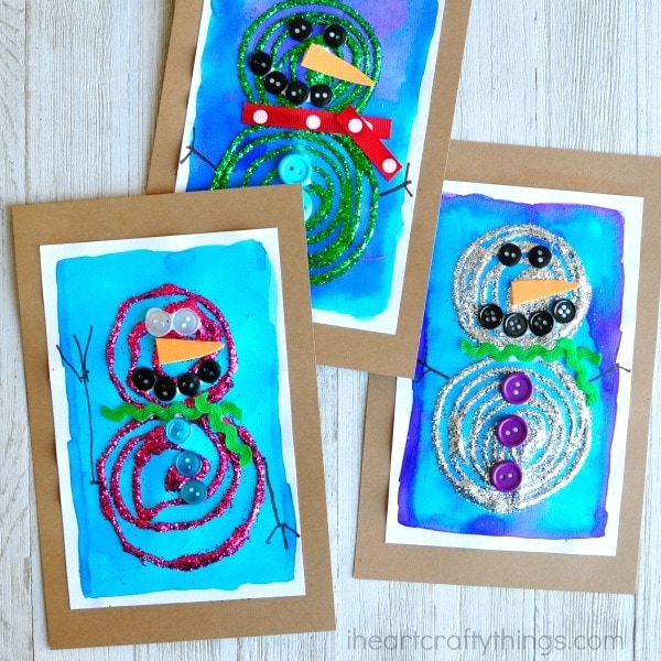 This swirly glue and glittery snowman craft is bright, gorgeous and perfect for displaying all winter long. Fun preschool craft and winter kids craft.