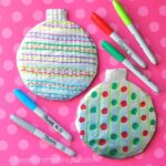 Kids will love getting creative designing a Tin Foil Christmas Bauble Craft. Great Christmas Craft for kids of all ages, especially preschoolers.