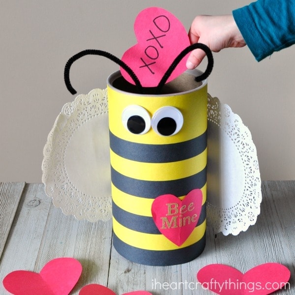 This Bee Valentine Box made out of an oatmeal container is simple to make and is perfect for Valentine's Day. Awesome DIY Valentine's Box.