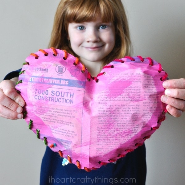 This painted newspaper puffy heart craft is a fun Valentine's Day craft for kids that uses recyclable materials and works fine motor skills.