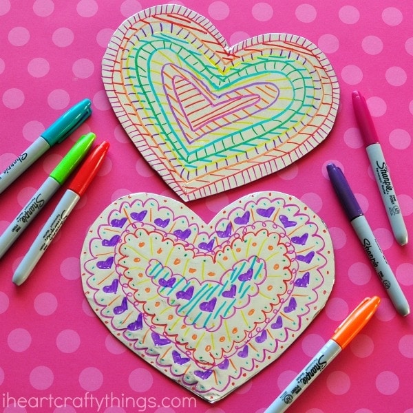 This tin foil heart Valentine's Day craft is shiny and colorful and makes a fabulous craft for kids of all ages. Fun toddler craft, preschool craft and Valentine's Day crafts for kids.