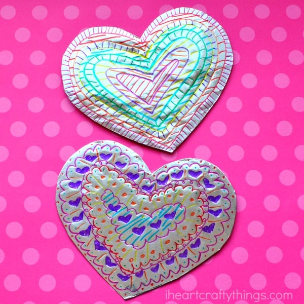 This tin foil heart Valentine's Day craft is shiny and colorful and makes a fabulous craft for kids of all ages. Fun toddler craft, preschool craft and Valentine's Day crafts for kids.