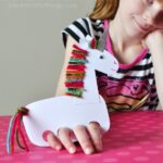 These incredibly cute and playful unicorn puppets make a fun kids craft and evergreen craft for any time of the year. Fun unicorn kids craft, winter kids craft, spring kids craft, summer kids craft, fall kids craft, crafts for pretend play and preschool craft.