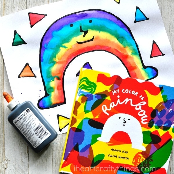 This black glue and watercolor resist rainbow craft makes a perfect spring craft for kids and goes along great with the book My Color is Rainbow by Agnes Hsu. Fun preschool art activity, rainbow kids craft and book inspired craft.