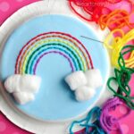 This paper plate rainbow yarn art craft is great for introducing kids to sewing. Great rainbow craft for kids and fun spring kids craft.