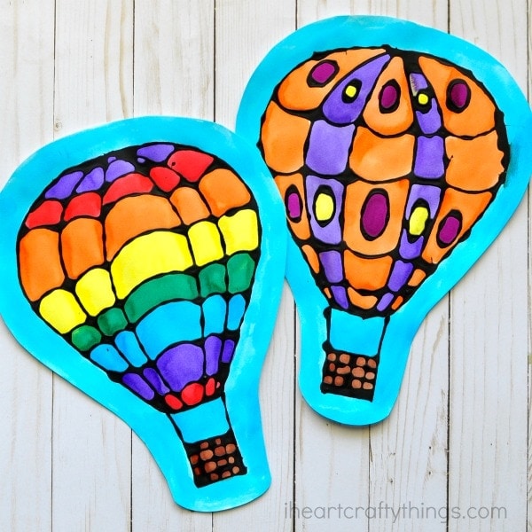 Beautiful watercolor and black glue hot air balloon craft, perfect for a spring kids craft, spring art project for kids and watercolor craft for kids.