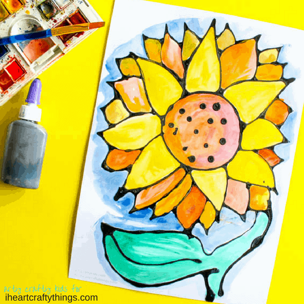 This black glue sunflower craft is an awesome art project for kids, fun summer kids craft, sunflower kid craft and black glue art project.