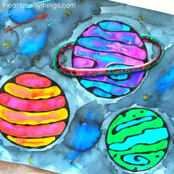 This black glue galaxy craft makes an awesome summer kids craft, solar system crafts, art projects for kids and blue glue art project.