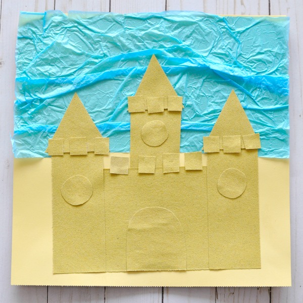 Awesome sand paper sand castle craft for kids. Great beach craft, ocean crafts for kids, sensory craft and preschool shape crafts.