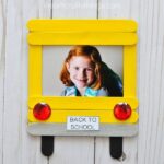 Cherish first day of school memories with this darling DIY back-to-school photo frame. Fun back-to-school crafts for kids and back-to-school activities.