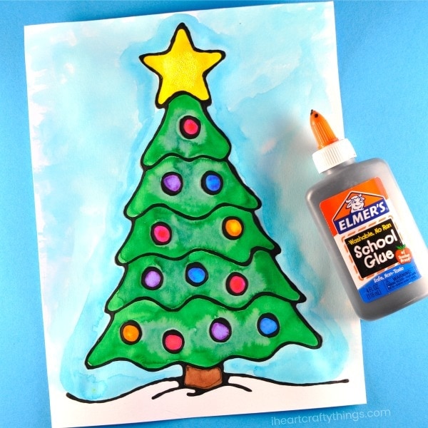 Beautiful black glue Christmas tree art project for kids. Fun Christmas arts and crafts, black glue art for kids and Christmas tree craft.