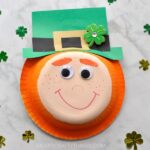 I'm a redhead so naturally I get uberexcited when St. Patrick's Day rolls around every year and I have an excuse to make cute little orange-haired leprechaun crafts. This paper bowl leprechaun craft is super easy to make for a fun St. Patrick's Day arts and crafts activity.