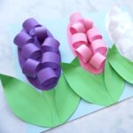 Learn how to make these beautiful paper Hyacinth flowers for a fun spring craft. The petals and leaves pop off the page giving the craft an awesome 3D effect. Find more fun spring flower crafts on our website too like tulip crafts, hyacinth crafts and cupcake liner flowers.