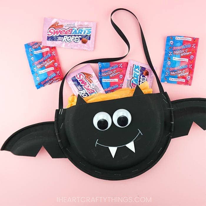 This paper plate Halloween candy holder is a great Halloween craft for kids to make at a Halloween party. Fun bat craft and Halloween paper plate crafts.