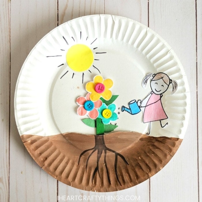 Paper plate growing flower craft for kids to enjoy for a spring craft. Easy craft for Preschoolers, watching their flowers grow out of the soil.