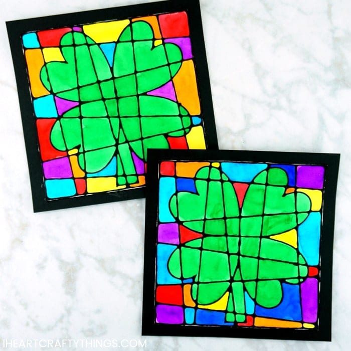 Gorgeous St. Patrick's Day Art Project for kids -Colorful black glue four leaf clover artwork. Craft resembles stained glass art project for kids.