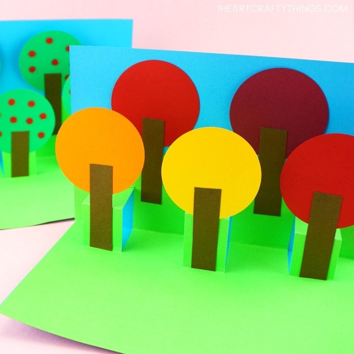 Celebrate the colors of fall with this simple pop up tree card. Easy paper craft for kids to make. More fun pop up card crafts for Christmas and year round.