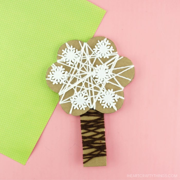 Square close up image of yarn wrapped winter tree craft.