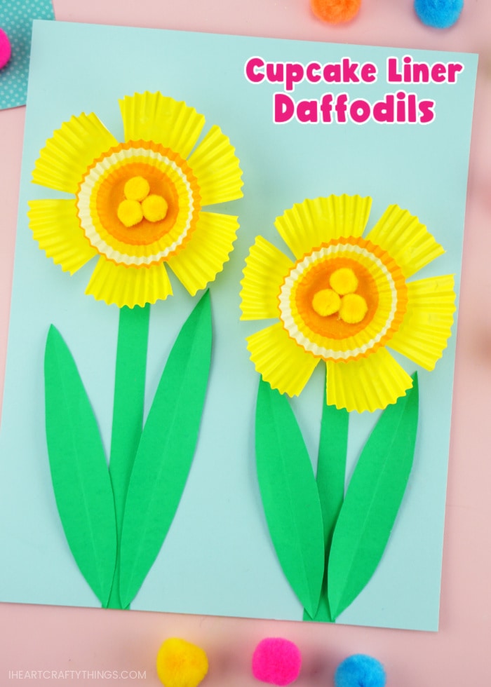 Vertical close up image showing finished daffodil craft with the text "cupcake liner daffodils" in the top right corner.